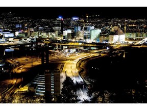 The city center skyline stands illuminated at night, seen from the Ekeberg hill, in Oslo. The nation has mostly withstood the fallout from Europe after funneling its oil revenue into a $730 billion sovereign wealth fund, the world's biggest.