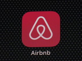 FILE - The Airbnb app icon is displayed on an iPad screen in Washington, D.C., on May 8, 2021. NerdWallet looked at the price of 1,000 Airbnb listings and compared them to the cost of hotels. Airbnbs can be an affordable alternative to hotels, particularly for longer stays, large groups and for people who need a washer and dryer or kitchen. But beware of vacation rental cleaning fees that can make the price skyrocket, and take advantage of discounts for monthlong stays.