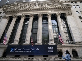FILE - Pedestrians walk past the New York Stock Exchange, Thursday, May 5, 2022, in the Manhattan borough of New York. Stocks open wide lower on Wall Street and Treasury yields rise ahead of a key interest rate decision by the Federal Reserve. The S&P 500 index was down 1.2% at the start of Tuesday, September 20, 2022.