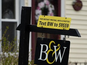 FILE - A sign is displayed outside a home in Wheeling, Ill., May 5, 2022. Average long-term U.S. mortgage rates climbed over 6% this week for the first time since the housing crash of 2008, threatening to sideline even more homebuyers from a rapidly cooling housing market. Mortgage buyer Freddie Mac reported Thursday, Sept. 15, 2022 that the 30-year rate rose to 6.02% from 5.89% last week.