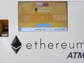 FILE - An ethereum ATM is seen in Hong Kong, Friday, May 11, 2018. A complex software change enacted Wednesday, Sept. 14, 2022, to the cryptocurrency ethereum holds the potential to dramatically reduce its energy consumption -- and resulting climate-related pollution. But the transition known as "the merge" is not going to do the trick by itself.