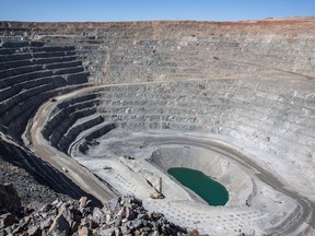 Heavy equipment operates in an open pit at the Oyu Tolgoi copper-gold mine in Mongolia.