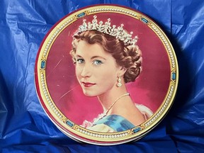The cookie tin that started Joy Suluk's collection of Queen Elizabeth II memorabilia in the early 1980s.