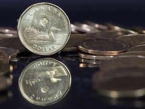Canadian dollar coins are displayed in Montreal, Friday, January 30, 2015.