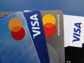 Credit cards as seen Thursday, July 1, 2021, in Orlando, Fla. A new study shows Canadians are charging slightly less to their primary credit cards than they did a year ago as inflation remains high and buy now, pay later services grow more prominent.