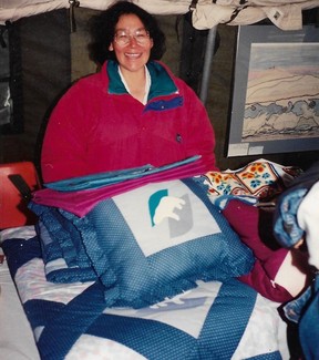 Joy Suluk and the quilt she sold to the Queen and Co. in 1994.