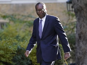 Britain's Chancellor of the Exchequer Kwasi Kwarteng arrives in Downing Street in London, Wednesday, Sept. 7, 2022 for the first cabinet meeting since Liz Truss was installed as British Prime Minister a day earlier.
