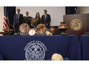 Mike Alfonso, Assistant Special Agent in Charge, Homeland Security Investigations, Consul General of Italy in New York, Fabrizio Di Michele, Executive Assistant District Attorney of New York County Lisa Delpizzo and General Roberto Riccardi of the Carabinieri Command for the Protection of Cultural Heritage pose for a photo during a news conference and repatriation ceremony, announcing the return of stolen antiquities to Italy, on Tuesday, Sept, 6, 2022, in New York