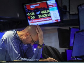 A trader reacts on the floor of the New York Stock Exchange.