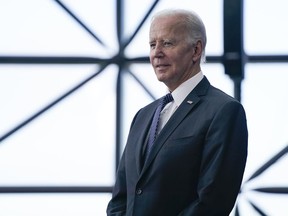 President Joe Biden listens as Ambassador Caroline Kennedy speaks before Biden about the cancer moonshot initiative at the John F. Kennedy Library and Museum, Monday, Sept. 12, 2022, in Boston. Biden is set to sign an executive order that aims to sharpen the national security considerations taken in the federal government's review process for foreign investment in the United States.