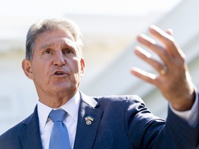 FILE - Sen. Joe Manchin, D-W.Va., speaks to reporters outside the West Wing of the White House in Washington, Aug. 16, 2022, after President Joe Biden signed the Democrats' landmark climate change and health care bill. Manchin made a deal with Democratic leaders as part of his vote pushing the party's highest legislative priority across the finish line last month. Now, he's ready to collect. But many environmental advocacy groups and lawmakers are balking.