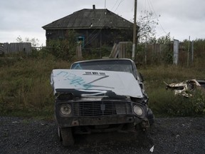 The letter Z, which has become the Russian emblem for the war, is seen on a damaged car in the freed village of Hrakove, Ukraine, Tuesday, Sept. 13, 2022.