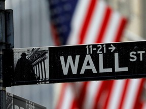A sign for Wall Street outside the New York Stock Exchange.