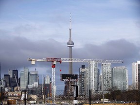 Condominiums and the CN Tower are shown along the Toronto skyline on Tuesday, April 25, 2017. The Toronto Regional Real Estate Board says the average cost for a one-bedroom condo soared by more than 20 per cent to $2,481 between the third quarter of this year and the same period last year.