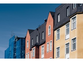 Brightly painted residential houses stand in the Kungsholmen district of Stockholm, Sweden, on Wednesday, June 28, 2017. Just as Sweden's biggest mortgage banks start raising interest rates, the country's state-backed home-loan provider says it's cutting customers' borrowing costs in a move that threatens to hurt industry profits after years of negative rates.
