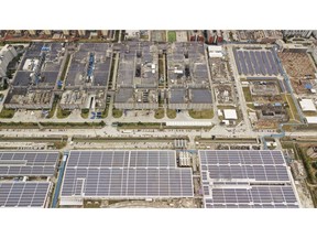 Solar panels are seen on rooftops at the Contemporary Amperex Technology Ltd. (CATL) headquarters and manufacturing complex in this aerial photograph taken in Ningde, Fujian Province, China, on Monday, Jan. 29, 2018. CATL already sells the most batteries to the biggest electric-vehicle makers in the biggest EV market: China. Now it wants to use proceeds from a pending initial public offering backed by Goldman Sachs Group Inc. to get under the hoods of more European marques and secure customers in the U.S. Photographer: Qilai Shen/Bloomberg