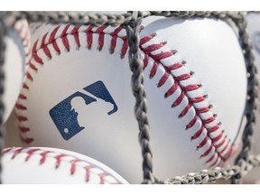 A baseball with MLB logo.