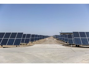 Photovoltaic panels stand at a solar power station operated by Huanghe Hydropower Development Co., a unit of State Power Investment Corp., at the Golmud Solar Park on the outskirts of Golmud, Qinghai province, China, on Tuesday, July 24, 2018. China has emerged as the global leader in clean power investment after it spent $127 billion in renewable energy last year as it seeks to ease its reliance on coal and reduce smog in cities, according to a report jointly published by the United Nations and Bloomberg New Energy Finance in April. Photographer: Qilai Shen/Bloomberg