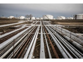 Oil transportation pipes and storage tanks stand in the Duna oil refinery, operated by MOL Hungarian Oil & Gas Plc, in Szazhalombatta, Hungary, on Monday, Feb. 13, 2019. Oil traded near a three-month high as output curbs by OPEC tightened global supply while trade talks between the U.S. and China lifted financial markets.
