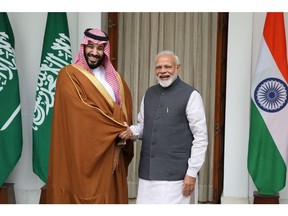 Mohammed Bin Salman, Saudi Arabia's crown prince, left, shakes hands with Narendra Modi, India's prime minister, at Hyderabad House in New Delhi, India, on Wednesday, Feb. 20, 2019. Prince Mohammed vowed to fight terrorism alongside India after talks with Modi, days after New Delhi accused Pakistan of planning a major terror attack in Kashmir.