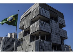 A Brazilian flag flies outside Petroleo Brasileiro SA (Petrobras) headquarters in Rio de Janeiro.
