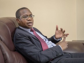 Mthuli Ncube, Zimbabwe's finance minister, speaks during an interview in Harare, Zimbabwe, on Thursday, Aug. 15, 2019. On the eve of major protests, which were called by the main opposition party over plunging living standards, Ncube said the country would establish a Monetary Policy Committee within a month that will cut interest rates, begin selling bonds with maturities of as long as 30 years, and proceed with a plan to privatize everything from state telecommunications companies to timber plantations.