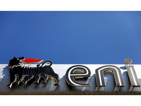 The ENI SpA logo sits on the company's gas station in Rome, Italy, on Friday, April 24, 2020. Eni reported a 94% drop in first-quarter profit and cut its production forecast for the year as demand is crushed by the coronavirus pandemic.