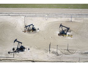 Oil well pump jacks operated by Chevron Corp. in San Ardo, California, U.S., on Tuesday, April 27, 2021. Oil climbed by the most in nearly two weeks with the OPEC+ alliance and BP pointing to signs of a robust demand recovery taking shape in parts of the world. Photographer: David Paul Morris/Bloomberg