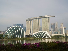 Gardens by the Bay, from left, Marina Bay Sands, and the central business district in Singapore, on Sunday, Oct. 3, 2021. Singapore is looking to launch new vaccinated travel lanes by the end of the year and is in negotiations with several countries including those in Europe and also the U.S., Trade Minister Gan Kim Yong said, signaling continued caution even as other advanced economies open up. Photographer: Ore Huiying/Bloomberg