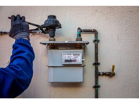 A Naturgy Energy Group SA gas technician installs an analogue gas meter at a residential apartment in Corbera De Llobregat, Spain, on Tuesday, Jan. 11, 2022. Natural gas prices in Europe jumped to the highest level in a week as fears about a possible military action in Ukraine raise concerns that Russian supplies may get even more limited during the coming winter months.