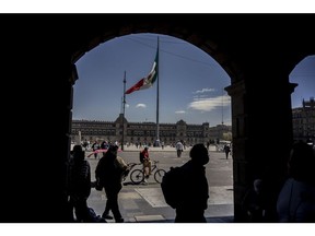 A Mexican flag flies at Constitution Square, known as Zocalo, in Mexico City, Mexico, on Friday Feb. 11, 2022. Mexico's annual inflation slowed less than expected in January, with a core metric hitting a 20-year high.