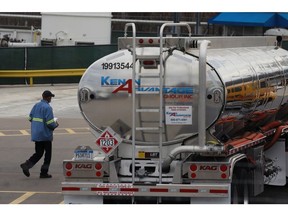A worker walks toward the cab of a gasoline tanker truck at the Valero Energy Corp. oil refinery terminal in Memphis, Tennessee, U.S., on Wednesday, Feb. 16, 2022. The U.S. and other major oil-consuming nations are considering releasing 70 million barrels of oil from their emergency stockpiles as crude prices surge amid growing concerns over supply after Russia invaded Ukraine. Photographer: Luke Sharrett/Bloomberg