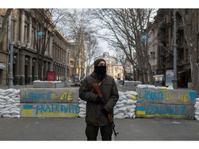 A Ukrainian soldier at a checkpoint in Odesa, Ukraine. Photographer: Nathan Laine/Bloomberg