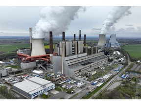 Cooling towers emit vapor at the Neurath lignite fueled power station, operated by RWE AG, in Grevenbroich, Germany, on Friday, April 8, 2022. Germany's Economy Minister Robert Habeck last week said the country has already cut its reliance on Russian coal by at least half in the past month as the European Union agreed to ban imports of the fuel from Russia.