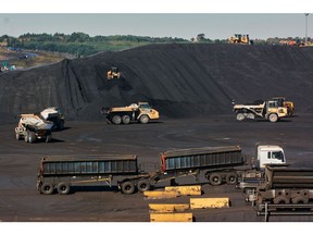 Trucks shift coal around a storage area at the Kusile coal-fired power station, operated by Eskom Holdings SOC Ltd., in Delmas, Mpumalanga province, South Africa, on Wednesday, June 8, 2022. The coal-fired plant's sixth and last unit is expected to reach commercial operation in two years, with the fifth scheduled to be done by December 2023. Photographer: Waldo Swiegers/Bloomberg