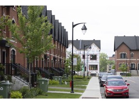 Homes under construction in Lasalle, Quebec, Canada, on Thursday, June 2, 2022. Bank of Canada Governor Tiff Macklem said rising interest rates aren't expected to derail the nation's economy and may even produce a "healthy" slowdown in the housing market.