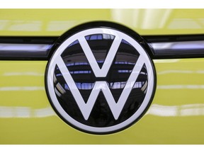 The badge of a Volkswagen ID Buzz electric microbus at the Volkswagen AG (VW) multipurpose and commercial vehicle plant in Hannover, Germany, on Thursday, June 16, 2022. Europe's biggest automaker is set to become the world's biggest electric-car maker, inching past rival Tesla Inc. by 2024, according to Bloomberg Intelligence. Photographer: Alex Kraus/Bloomberg