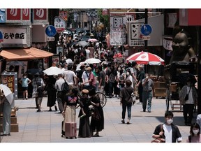 Pedestrians walk through a restaurant district in the Shinsekai neighborhood in Osaka, Japan, on Sunday, June 19, 2022. Japan is scheduled to release consumer price index (CPI) figures on June 24. Photographer: Soichiro Koriyama/Bloomberg