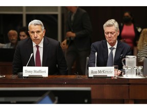 Tony Staffieri, president and chief executive officer of Rogers Communications Inc., left, and Ron McKenzie, chief technology and information officer of Rogers Communications Inc., during a Standing Committee on Technology and Industry hearing in Ottawa, Ontario, Canada, on Monday, July 25, 2022. Rogers expects to spend C$10 billion ($7.7 billion) over the next three years to improve network reliability after a massive outage this month, Staffieri said in a letter to customers seen by the Globe and Mail.