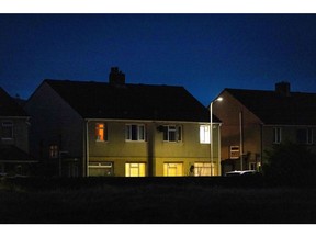 Partially lit residential homes near the steel works operated by Tata Steel Ltd. in Port Talbot, UK. Photographer: Hollie Adams/Bloomberg