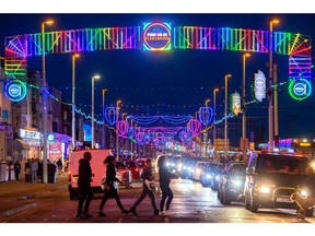 Visitors at the Blackpool Illuminations annual lights festival along the Promenade in Blackpool, UK, on Saturday, Sept. 10, 2022. UK Prime Minister Liz Truss unveiled plans to freeze electricity bills for two years from October and introduce a cap to protect businesses for at least six months.