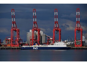 A P&O Ferries Ltd. freight vessel sails past ship to shore cranes at the Port of Liverpool during a strike in Liverpool, UK, on Tuesday, Sept. 20, 2022. Dockers at Britain's fourth-biggest container port voted unanimously to reject their employer's latest pay offer -- and walk off the job for two weeks in a strike that gets into full swing on Tuesday.