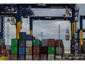A gantry crane lifts a container on the dockside during the first day of the second-round of strike action by Unite union members and dockworkers at the Port of Felixstowe in Felixstowe, UK, on Tuesday, Sept. 27, 2022. Dock workers at Felixstowe, Britain's largest container port, rejected a pay deal imposed by management, that paved the way for this new round of industrial action and disruption to vital trade flows. Photographer: Chris J. Ratcliffe/Bloomberg