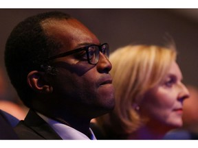 Kwasi Kwarteng, UK chancellor of the exchequer, left, and Liz Truss, UK prime minister, attend the Conservative Party's annual autumn conference in Birmingham, UK, on Sunday, Oct. 2, 2022. Truss acknowledged her UK government mishandled the announcement on unfunded tax cuts which triggered a week of turmoil in financial markets, while insisting her approach is the correct one.