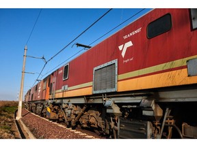 The locomotive of a Transnet SOC Ltd. freight train transports wagons of coal from the Mafube open-cast coal mine, operated by Exxaro Resources Ltd. and Thungela Resources Ltd., towards Richard's Bay coal terminal, in Mpumalanga, South Africa on Thursday, Sept. 29, 2022. South Africa relies on coal to generate more than 80% of its electricity, and has been subjected to intermittent outages since 2008 because state utility Eskom Holdings SOC Ltd. can't meet demand from its old and poorly maintained plants.