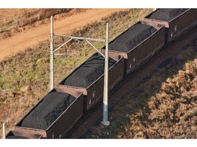 Freight wagons transport coal from the Mafube open-cast coal mine, operated by Exxaro Resources Ltd. and Thungela Resources Ltd., towards Richard's Bay coal terminal, in Mpumalanga, South Africa on Thursday, Sept. 29, 2022. South Africa relies on coal to generate more than 80% of its electricity, and has been subjected to intermittent outages since 2008 because state utility Eskom Holdings SOC Ltd. can't meet demand from its old and poorly maintained plants. Photographer: Waldo Swiegers/Bloomberg