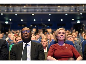 BIRMINGHAM, ENGLAND - OCTOBER 02: Chancellor of the Exchequer Kwasi Kwarteng and British Prime Minister Liz Truss attend the annual Conservative Party conference on October 02, 2022 in Birmingham, England. This year the Conservative Party Conference will be looking at "Getting Britain Moving" with more jobs and higher salaries. However, delegates are arriving at the conference as the party lags 33 points behind Labour in the opinion polls.