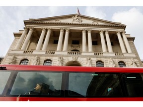 A bus passes the Bank of England (BOE) in the City of London, UK, on Monday, Oct. 3, 2022. Traders are the most negative ever on the pound's prospects, even after the UK government scrapped one of its new tax policies, a sign it will take a bigger policy U-turn to restore credibility with markets.