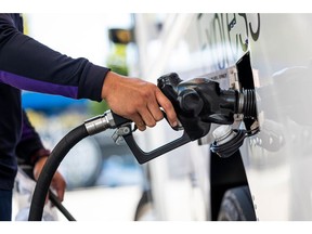 A worker refuels a FedEx truck at a Chevron gas station in San Francisco, California, US, on Monday, Oct. 3, 2022. California Governor Gavin Newsom called for a windfall tax on oil companies and allowed for production of a cheaper blend of gasoline as the state faces a surge in fuel prices.