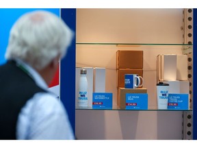 A waterbottle and travel coffee cup with the slogan "In Liz We Truss" and a mug with the slogan "Liz For Leader" for sale on a merchandise stand during the Conservative Party's annual autumn conference in Birmingham, UK, on Tuesday, Oct. 4, 2022. Liz Truss will struggle to drive through key parts of the economic revolution she's planning for the UK because her standing in the ruling party is already so damaged, members of her Cabinet said. Photographer: Hollie Adams/Bloomberg